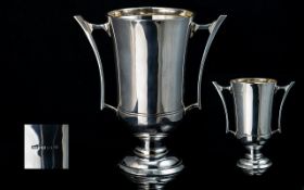 Art Deco Period Stylish Sterling Silver, Twin Handle Trophy Vase, raised on a circular stepped base.