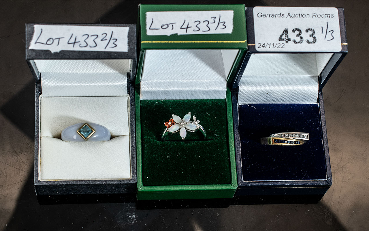 Three Gold Dress Rings, a 14ct Sapphire & Diamond ring, a white gold set with Opal 9ct gold, and a