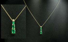 Ladies - Attractive 14ct Gold Emerald Set 3 Stone Drop Pendant, Attached to a 14ct Gold Chain.