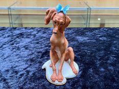 Capodimonte Dog Figure with Blue Butterfly on its head, signed Gelle to base and marked Italy