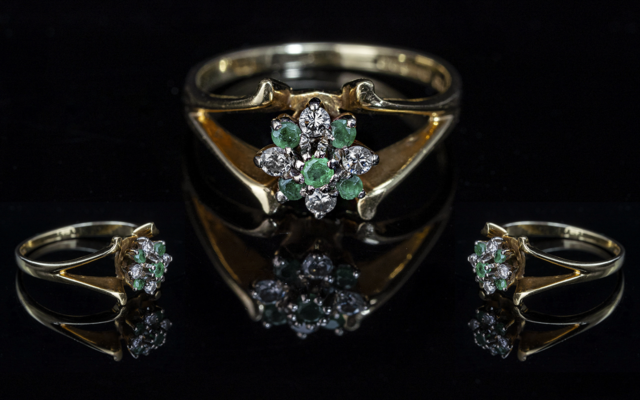 18ct Gold Attractive Emerald & Diamond Set Cluster Ring. Full hallmark for 750 - 18 cts. Emerald and