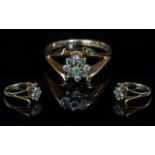 18ct Gold Attractive Emerald & Diamond Set Cluster Ring. Full hallmark for 750 - 18 cts. Emerald and