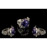 Russian Charoite Ring, a 12.75ct cabochon cut charoite set in a decorative, hand crafted, silver