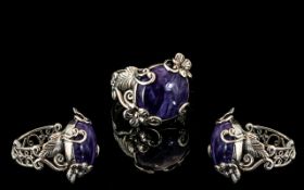 Russian Charoite Ring, a 12.75ct cabochon cut charoite set in a decorative, hand crafted, silver