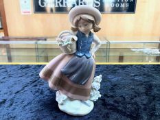 Lladro Figure No. 5221 ''Sweet Scent'', Girl with Basket of Flowers, 7'' tall.