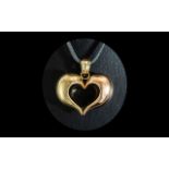 Large 14ct Two Tone Heart Pendant, unmarked, tests 14ct. Approx 1.75'' x 1.75''. Gross weight 11.5