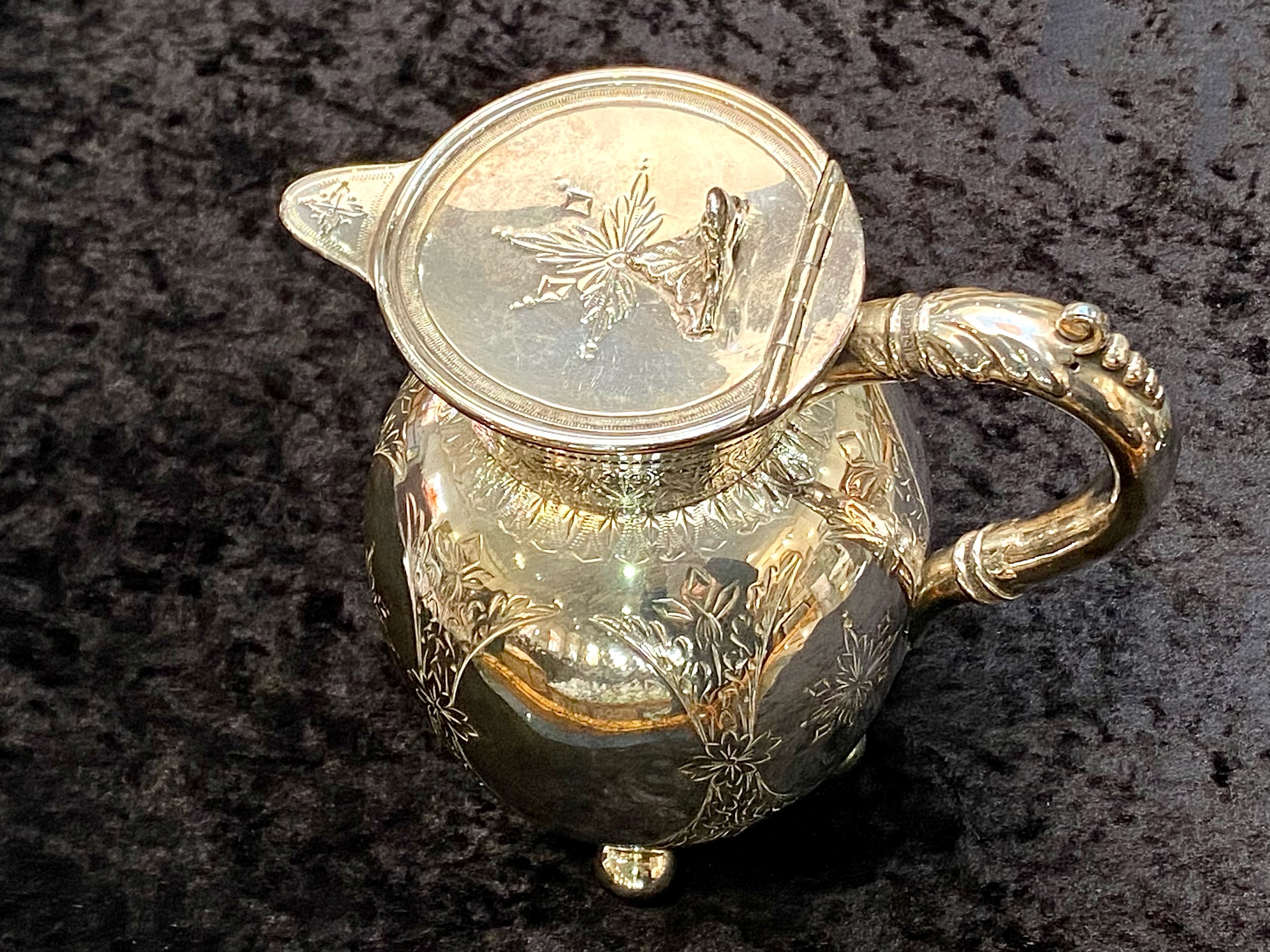 A Victorian Silver Plated Water Jug, raised on cannonball feet, with etched decorations. Height - Image 5 of 6