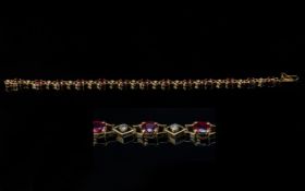 18ct Gold - Good Quality Ladies Ruby and Diamond Set Bracelet. Marked 18ct. Rubies and Diamonds of