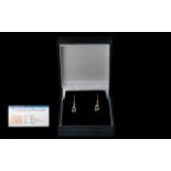 Ladies Pair of 18ct Gold Blue Topaz Set Earrings, marked 18ct. Weight of the Topaz 0.95 pts. Size