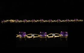 Ladies 18ct Gold - Attractive Amethyst and Diamond Set Bracelet. Marked 18ct. The Nine Oval Shaped