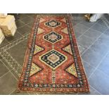 Terracotta Ground Persian Kashqai Nomadic Rug. Approx 3 m x 120 cm.