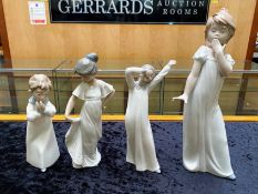 Four Nao Figures, comprising children ready for bed, a 12'' figure yawning, a child in a