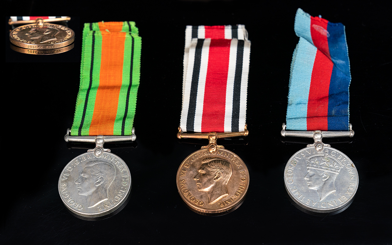 World War II Medals with Ribbons, awarded to Joseph Huxlow. 1. 1939 - 1945 Defence Medal with