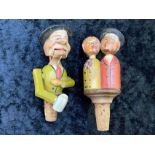 Two Antique Novelty Carved Wooden Figural Bottle Stoppers with lever operated moveable parts, one