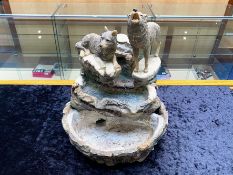 Figural Set of Two Wolves, one sitting and one standing and howling, raised on a base, with