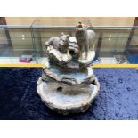 Figural Set of Two Wolves, one sitting and one standing and howling, raised on a base, with