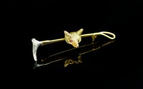 A Superb Quality 9ct 2 Tone Gold Brooch In the Form of a Foxes Head and Riding Crop. The Foxes