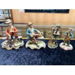 Four Capo di Monte Figures, comprising 2 x tramp on a bench, and 2 x fisherman. Tallest 9''.