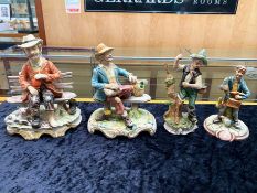 Four Capo di Monte Figures, comprising 2 x tramp on a bench, and 2 x fisherman. Tallest 9''.