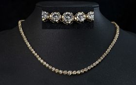 A Stunning 18ct Gold Graduated Diamond Set Necklace of Exquisite Form. Marked 18ct. The Round