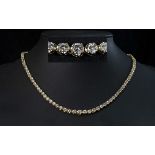 A Stunning 18ct Gold Graduated Diamond Set Necklace of Exquisite Form. Marked 18ct. The Round