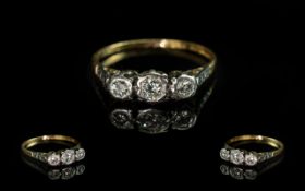 18ct Gold and Platinum 3 Stone Diamond Set Ring. Marked 18ct and Platinum. The 3 Round Faceted