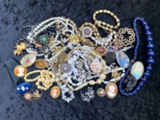 Quantity of Vintage Costume Jewellery, housed in a tin, including beads, pearls, pendants, chains,