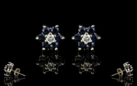 18ct White Gold Earrings Set with Diamonds & Sapphires with a flower head setting. Stamped 18ct.