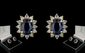 A Fine Pair of 18ct Gold Diamond and Sapphire Set Earrings. Marked 18ct to Post. Diamonds and