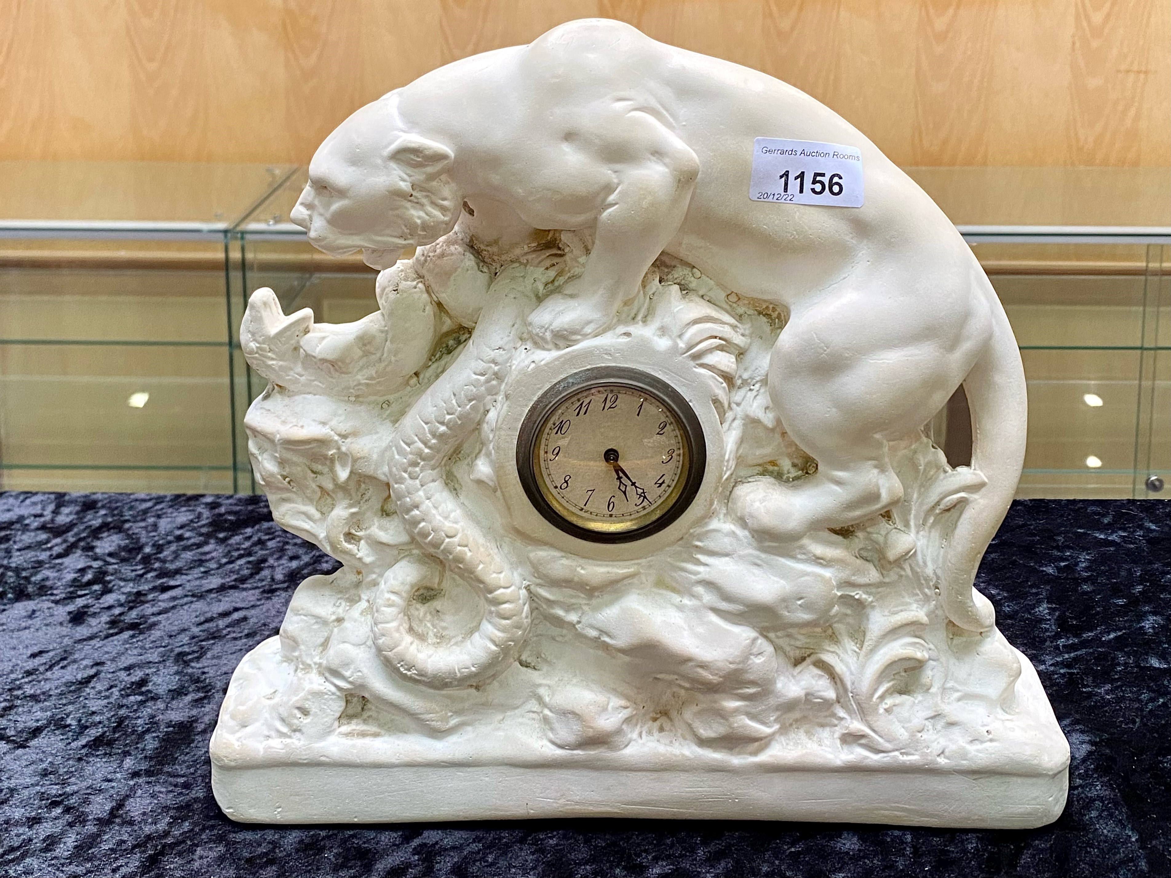 A Panther and Snake Alabaster Base with a Central Clock (1920's) number RD803644 marked OP267.