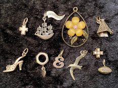 Small Collection of Jewellery, comprising nine Sterling Silver charms, including Celtic cross, shoe,