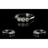 18ct White Gold Attractive 3 Stone Diamond Set Ring. The brilliant cut diamond of top colour and