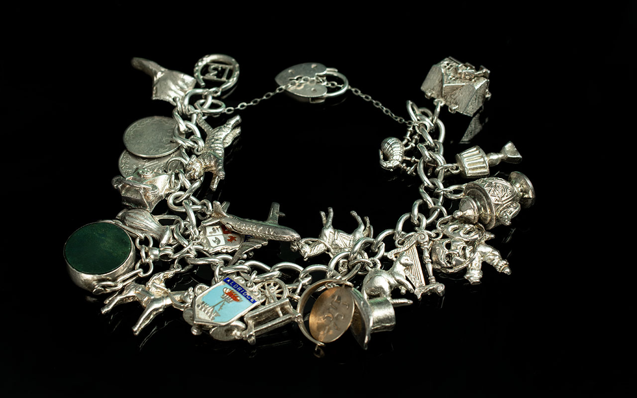 A Fine Quality Vintage Sterling Silver Charm Bracelet - Loaded With Approx 30 Silver Charms. All
