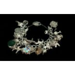 A Fine Quality Vintage Sterling Silver Charm Bracelet - Loaded With Approx 30 Silver Charms. All