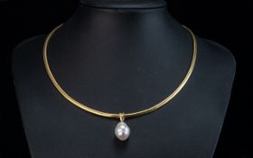 18ct Gold Snake Chain Necklace, set with a Baroque freshwater pearl drop. Gross weight 25 grams.