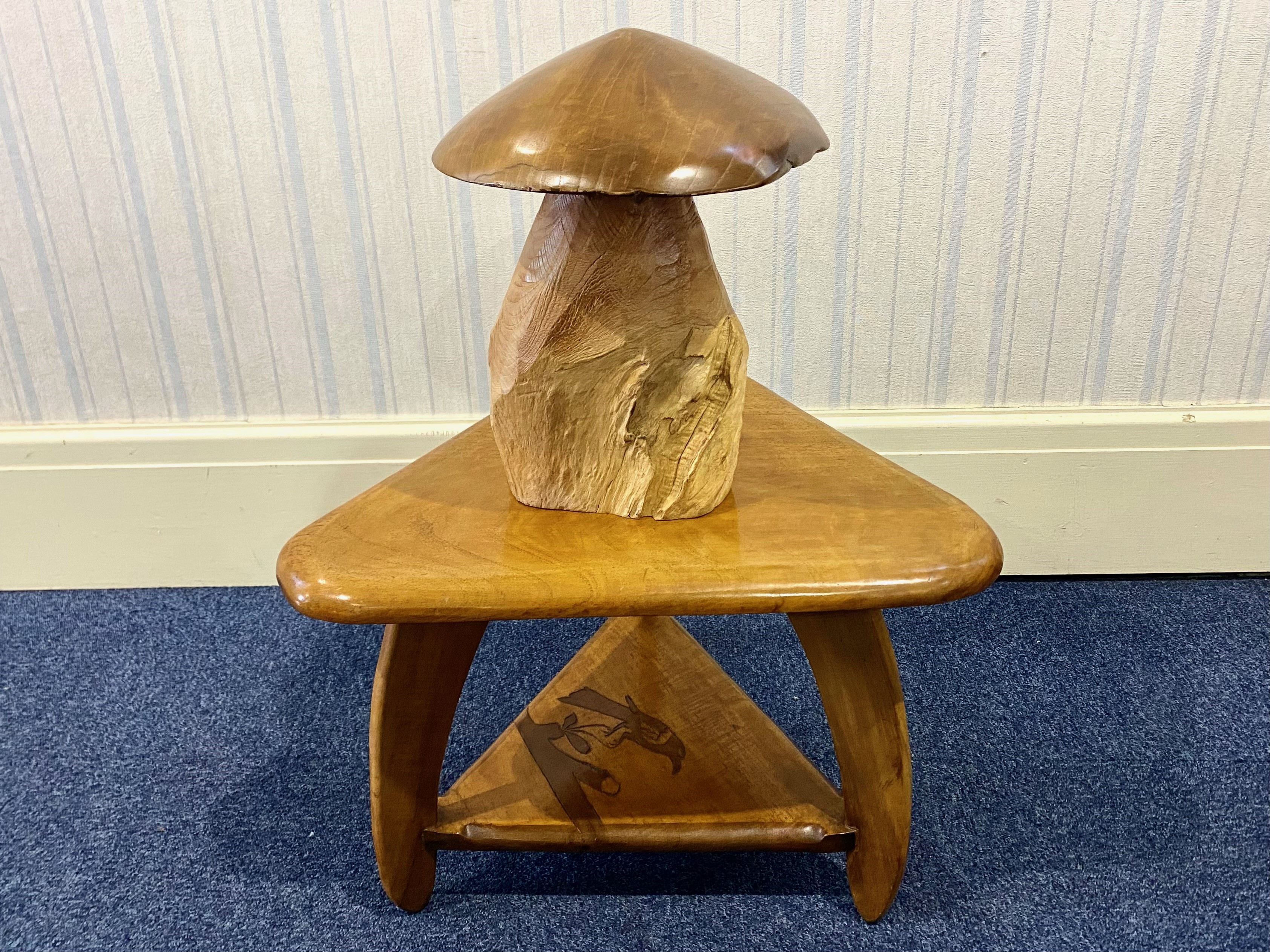 Triangular Wooden Side Table, raised on three legs, with a lower shelf decorated with an engraving