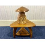Triangular Wooden Side Table, raised on three legs, with a lower shelf decorated with an engraving