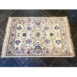 Ivory Ground Full Pile Kashmir Rug, all over floral design, measures 170 x 120 cm.