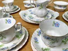 Richmond Bone China 'Blue Poppy' Tea Service, comprising a milk jug, two sugar bowls, seven teacups,