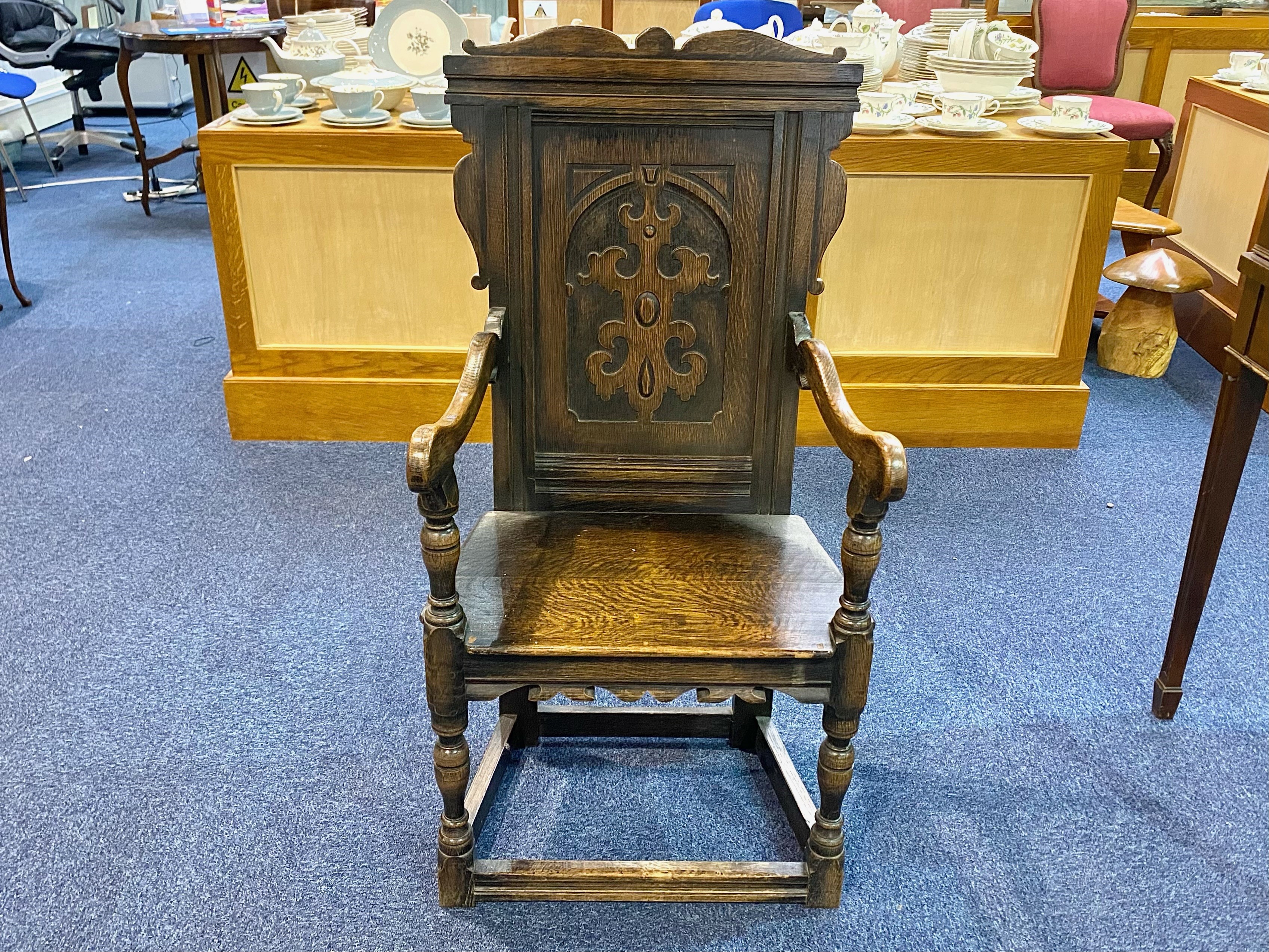 A Turn of The Century Gothic Style Oak Hall Chair 41 inches high by 21 inches wide.