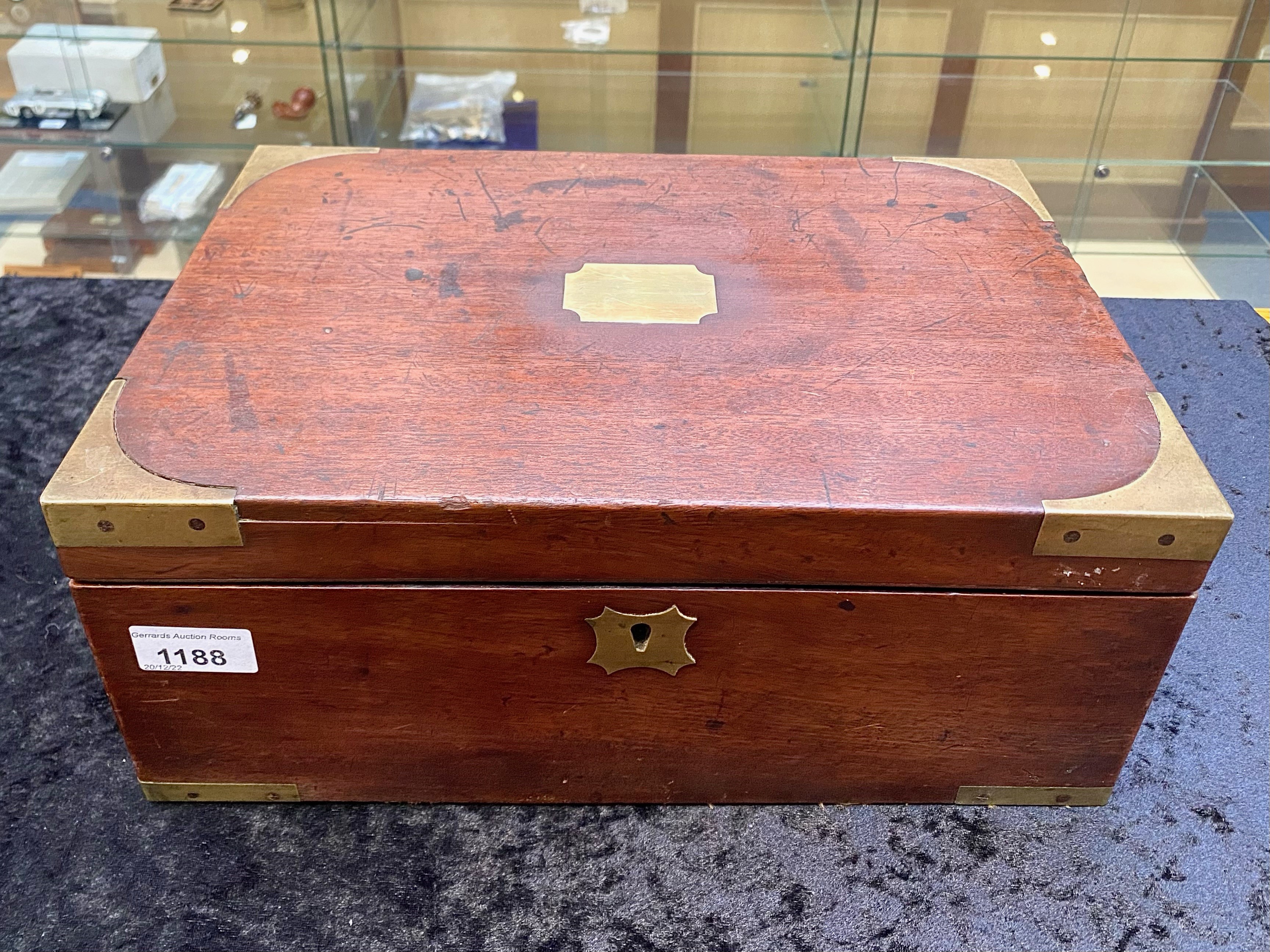 Antique Campaign Writing Chest in brass bound mahogany with recessed carrying handles and secret