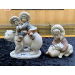 Pair of Lladro Eskimo Figures, comprising 'Eskimo Riders' No. 5353, two children riding on a polar