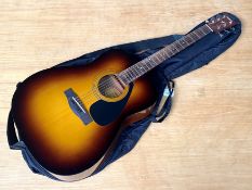 Yamaha Guitar F310P, Acoustic guitar with case, includes two instruction books for Beginners.