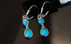 Turquoise Double Drop Earrings, each earring comprising a pear cut cabochon turquoise below a