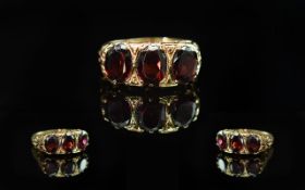 Ladies 9ct Gold Gallery Set 3 Stone Garnet Set Ring. Open-worked Setting. Full Hallmark for 9,375 to