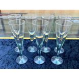 Contemporary Set of Seven Hand Blown Champagne Flutes, each with a hint of green colour; a stylish