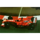 F1 Motor-racing interest; two signed photographs bearing signiatures of Michael Schumacher and David