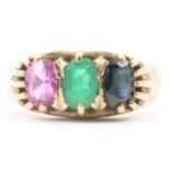 A gemstone ring set ring, emerald, sapphire and pink sapphire.