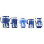 Five blue jasperware jugs