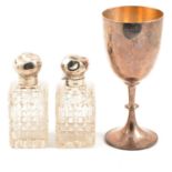 Victorian silver chalice, John Aldwinckle & Thomas Slater, and two silver-mounted cut glass bottles.